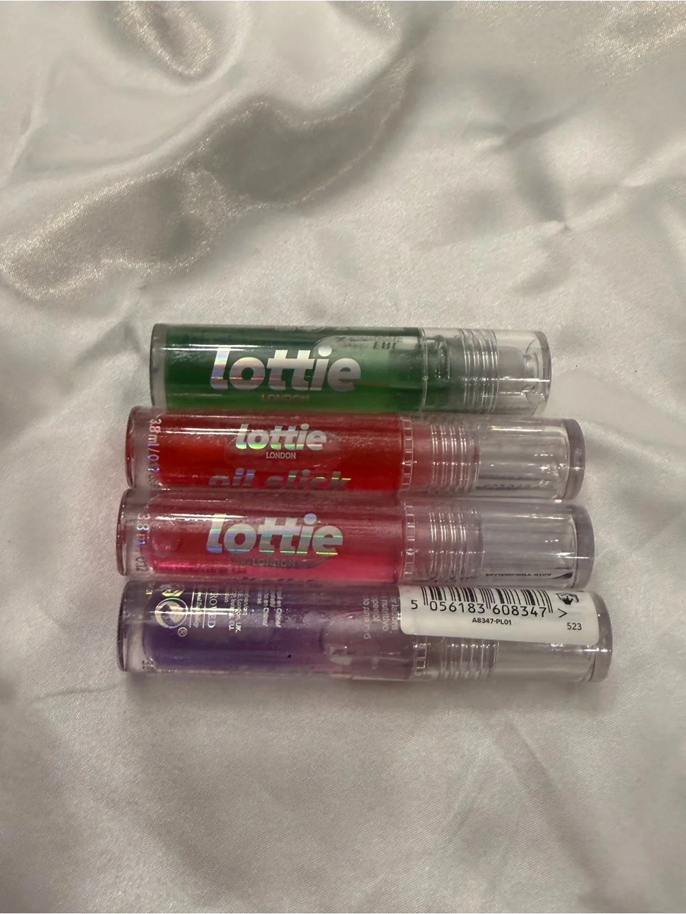 Lottie 4-Pack Oil Slick Nourishing Lip Oil Blueberry Cherries Strawberry‎ Apple